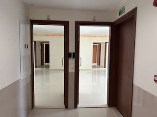 Income Tax Tribunal Approves Exemption for Two Flats Treated as a Single Home - Section 54F